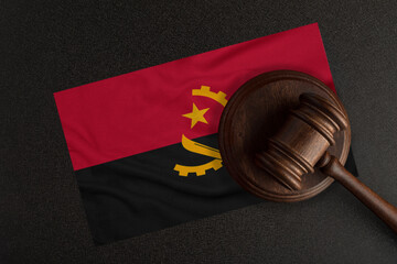 Judges hammer and the flag of Angola. Law and Justice. Constitutional law