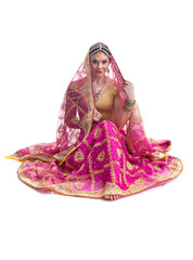 Beautiful young female Bollywood dancer in traditional bright pink wedding dress
