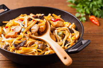 Indonesian pasta with chicken, pieces of bamboo and mushrooms.