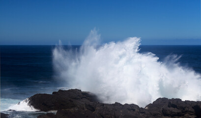 Gran Canaria, north coast, area around Punta Sardina cape, powerful foamy ocean waves breaking along the shore
