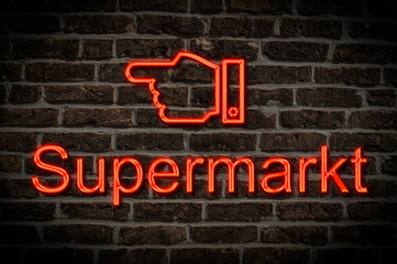 Fototapeta premium Leuchtreklame Supermarkt