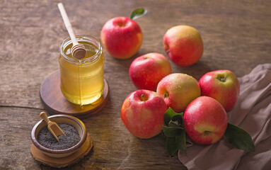 Apple and honey, traditional food of jewish New Year celebration, Rosh Hashana. Selective focus. Copyspace background