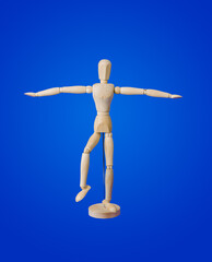 Sports wooden toy figure on blue