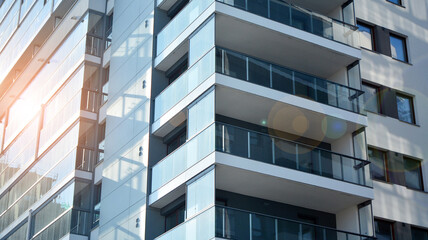 Apartment residential house and home facade architecture and outdoor facilities. Blue sky on the background. Sunlight in sunrise.