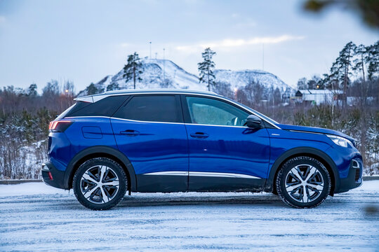 MOSCOW, RUSSIA - MARCH 15, 2020: side view of Blue SUV Peugeot 3008 on on winter landscape