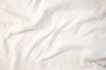 Fabric backdrop White linen canvas crumpled natural cotton fabric Natural handmade linen top view background Organic Eco textiles White Fabric texture