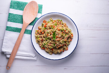 Quinoa salad with vegetables and mint oil