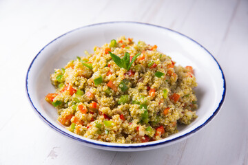 Quinoa salad with vegetables and mint oil