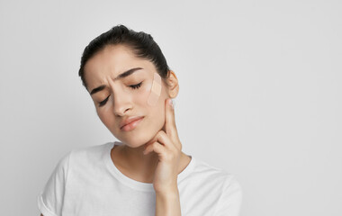 Fototapeta premium woman in white t-shirt pills health problems medicine treatment