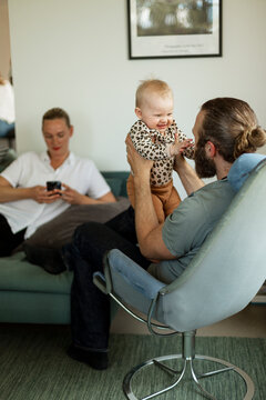 Father playing with baby girl