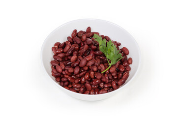 Boiled red kidney beans in white bowl on white background