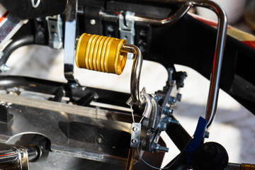 Anodized yellow Steel Brake Pedal On A Competition Go Kart