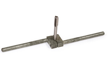 Plug tap fixed in tap wrench on a white background