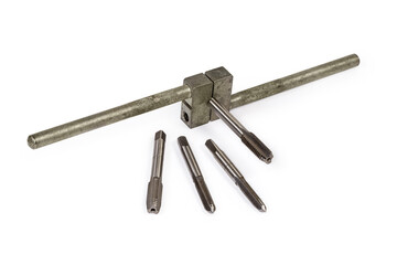 Plug tap fixed in tap wrench and several taps separately