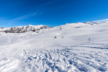 Fototapeta na wymiar Malga San Giorgio ski resort on Lessinia High Plateau in winter with snow and Carega Mountain also called the small Dolomites. Bosco Chiesanuova municipality, Verona province, Veneto, Italy, Europe.