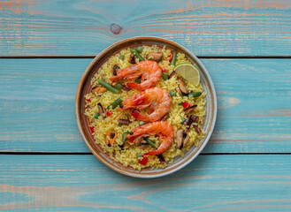 Spanish paella with seafood, shrimp and vegetables. Healthy eating. Spanish cuisine.
