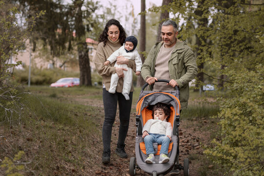 Parents With Two Children Having Walk