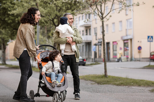 Parents With Two Children Having Walk