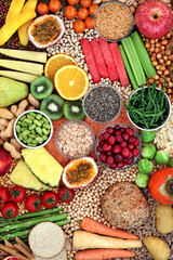Plant based high fibre healthy vegan food with fruit, vegetable, legumes, seeds, grain products and cereals. Foods high in antioxidants, omega 3, protein, vitamins, anthocyanins and  smart carbs.  