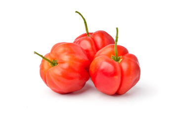 Group of three acerola cherry fruits on white background.