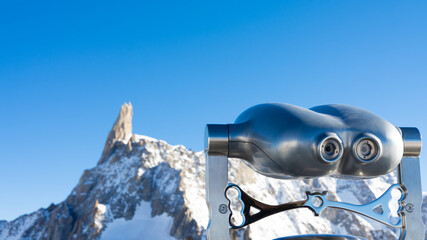 Binocular looking into a peak of Monte Bianco mountain massif. Useful metaphor for vision, achievement, aspiration, dream, ambition.