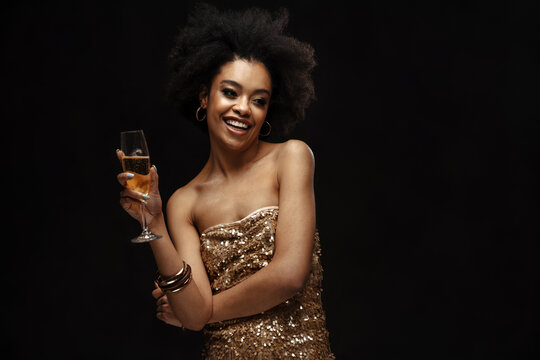 Happy African American Woman In Party Dress Drinking Champagne