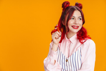 Happy girl with red hair smiling and looking aside