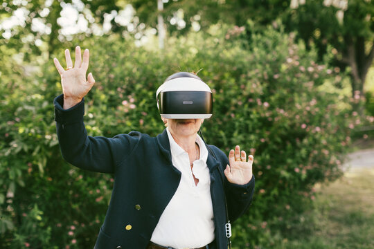 Woman in park using VR headset