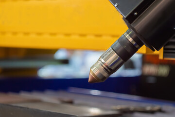 Automatic cnc laser cutting machine working in demo mode: close up. Industrial, equipment,...