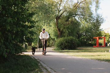 Man riding electric scooter in park
