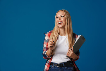 Excited beautiful blonde girl laughing while posing with clipboard