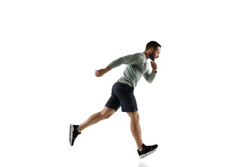 Fototapeta na wymiar Run. Young caucasian male model in action, motion isolated on white background with copyspace. Concept of sport, movement, energy and dynamic, healthy lifestyle. Training, practicing. Authentic.