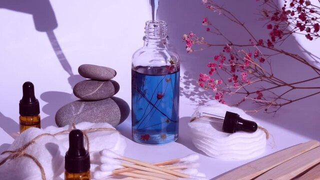 Reusable and recycable bathroom accessories on white background. Trendy shadows. Zero waste concept. Natural cosmetics and eco living concept. Essential oil or serum