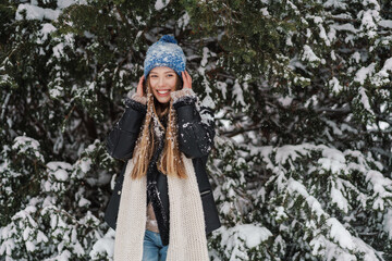 Happy attractive young woman in winter jacket