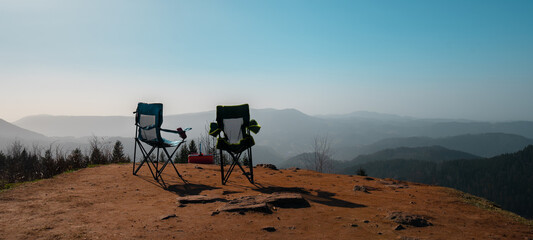 Leisure / Camping / Travel tourism Panorama Banner Background - Two camping chairs with...