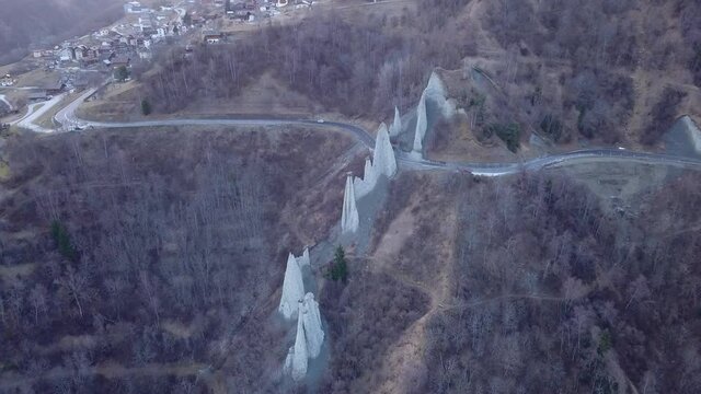 Panoramic view of Euseigne Pyramids or fairy chimneys in Switzerland. Aerial circling