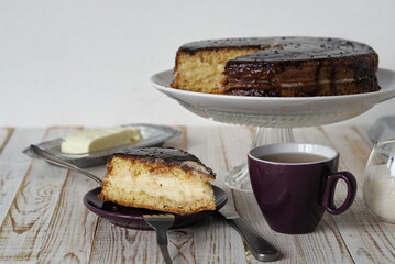 A piece of freshly made Enchantress cake topped with chocolate icing.Homemade healthy food.