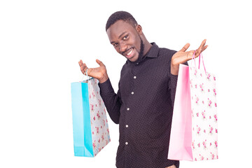 handsome young man holding shopping bags.