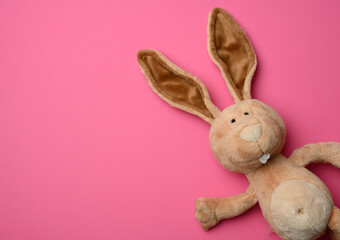 cute plush bunny with long ears, easter pink background