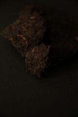 abstract tea background, black tea on dark background