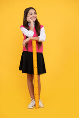 smiling teen girl hold ruler. back to school. algebra and geometry. kid study math.