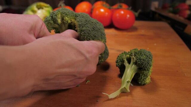 chef hands cutting broccoli 4k