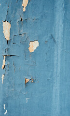 acked flaking white paint. Cracked weathered concrete wall wide texture. Background for wallpaper. 