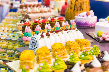 Catering sweets, closeup of various kinds of different types of Sweet Cakes in Bakery Shop