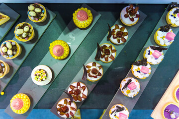 Catering sweets, closeup of various kinds of different types of Sweet Cakes in Bakery Shop