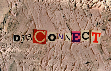 Disconnect word  on uneven non-uniform putty coating . Text space with light and shadow .