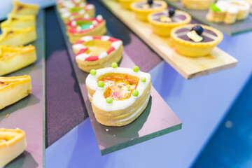 Catering sweets, closeup of various kinds of different types of Sweet Cakes in Bakery Shop