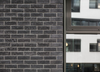 Schwarze brick wall with window. Brick wall facade. 
Black Backsteinmauer mit Fenster. 
Ziegelmauer...