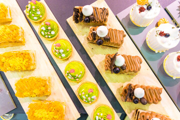 Catering sweets, closeup of various kinds of different types of Sweet Cakes in Bakery Shop