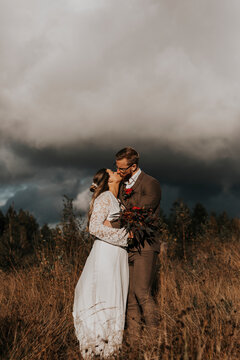 Bride and groom kissing